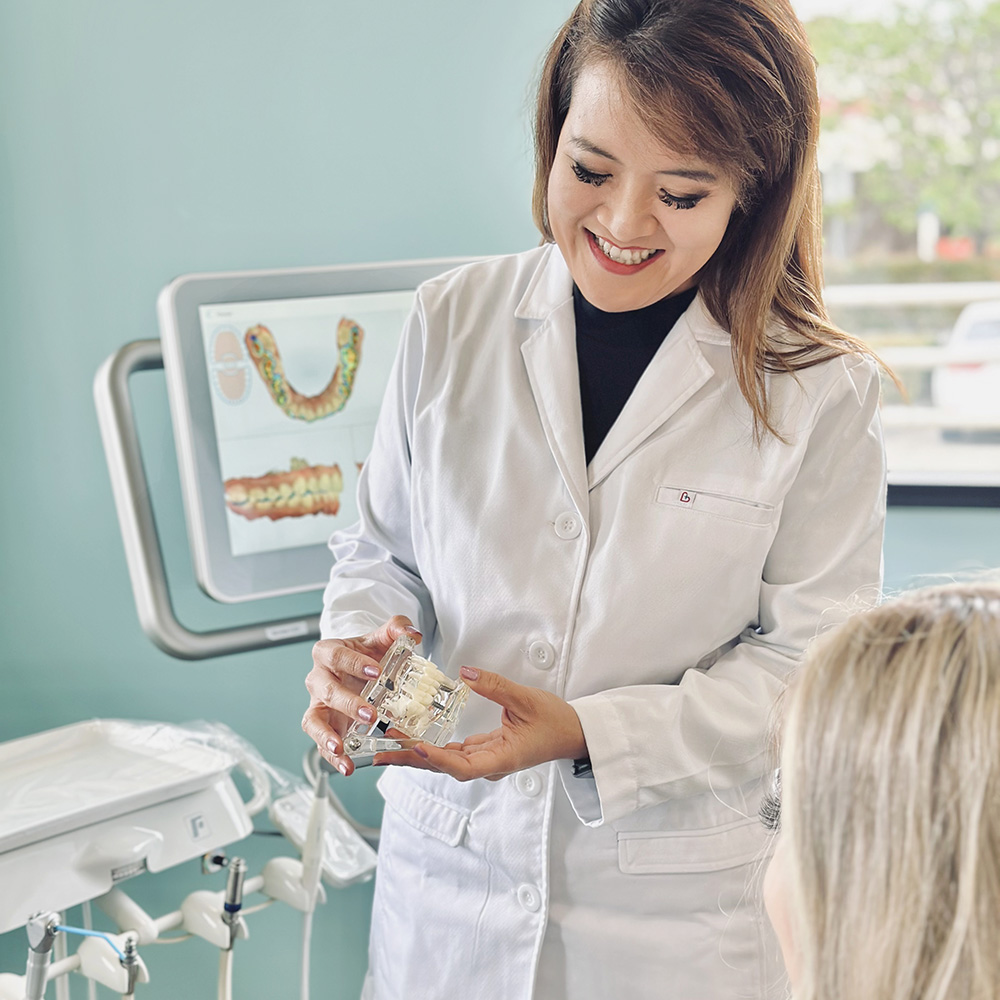 Dr. Pham cosmetic dentist - consulting with patient on dental veneers 