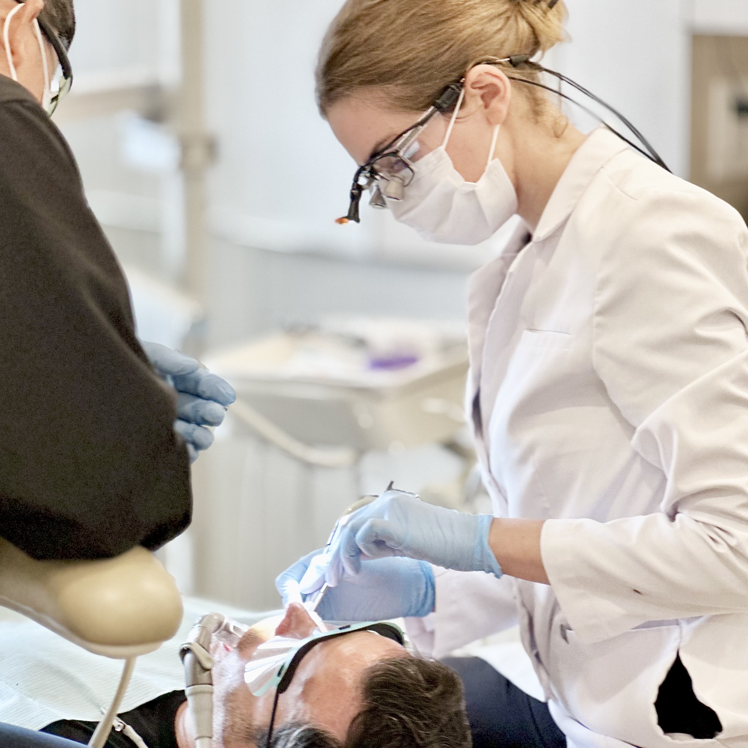 Dr. Central focusing on relieving patient's pain at Oceanic Dental